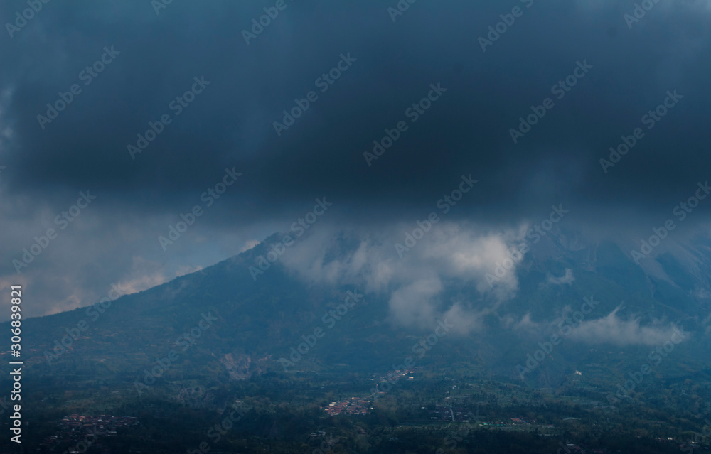 dramatic clouds covered mount Merapi