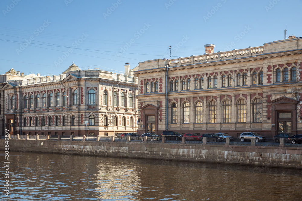 Historic buildings of the loan treasury (left) and state savings banks (right) on the Fontanka River embankment were built in 1900. St. Petersnurg, Russia