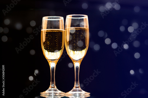 Two champagne glasses ready to bring in the New Year