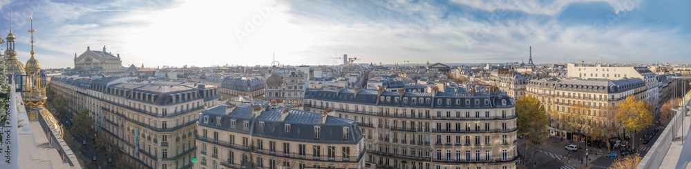 Paris, France - 11 30 2019: Boulevard Haussmann. Panoramic view of Paris from the roofs of department stores