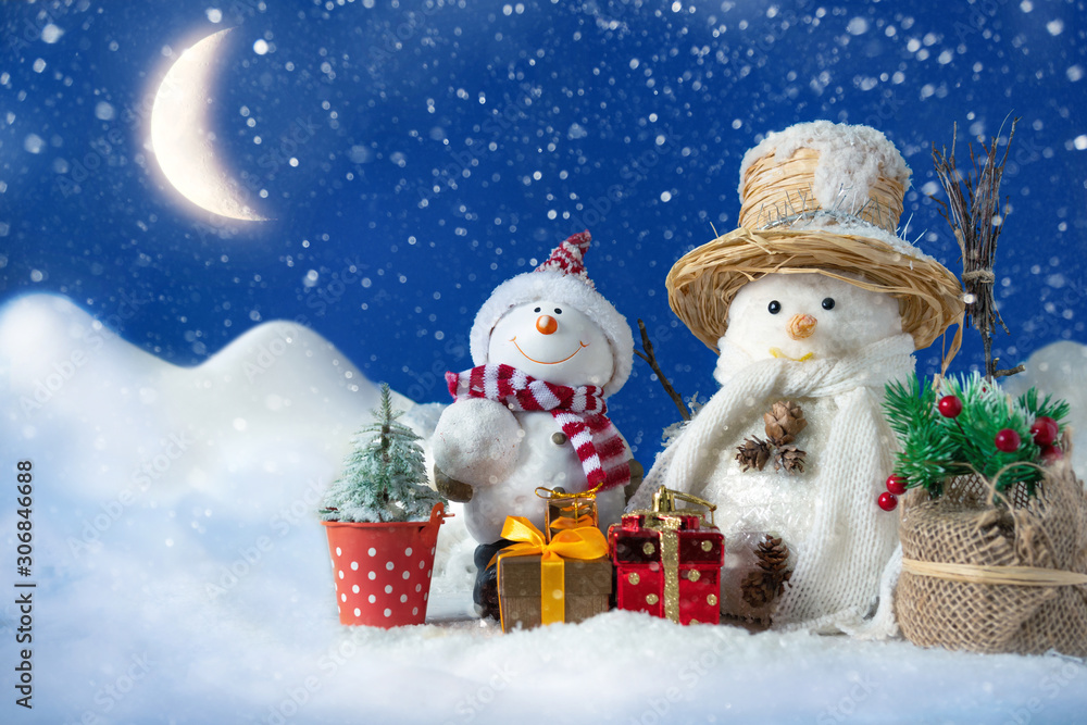 Snowman in a snowdrift with gifts for Christmas and New year Snowman in a snowdrift with gifts for Christmas and New year