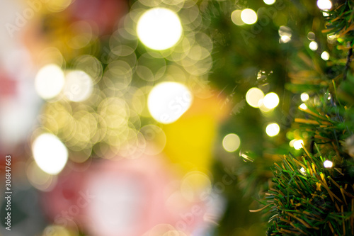 Leaves pine on Blurred bokeh light Christmas tree.background for add text message. © jajam_e
