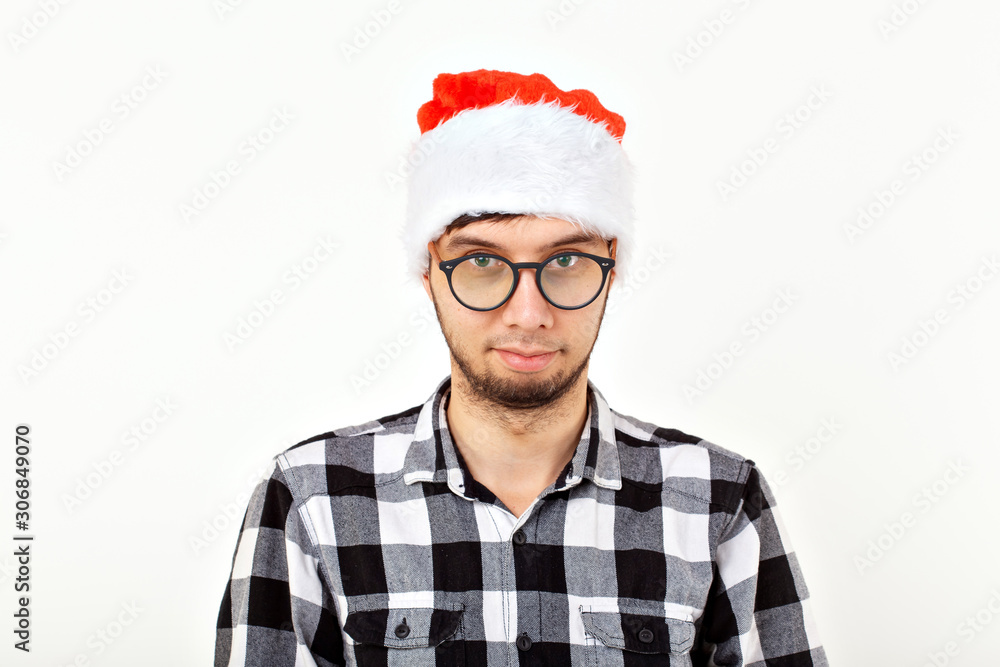 Holidays and presents concept - Funny emotional man in Christmas hat on white background Holidays and presents concept - Funny emotional man in Christmas hat on white background