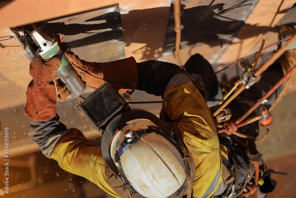 Tope view of rope access technician welder services working at height
