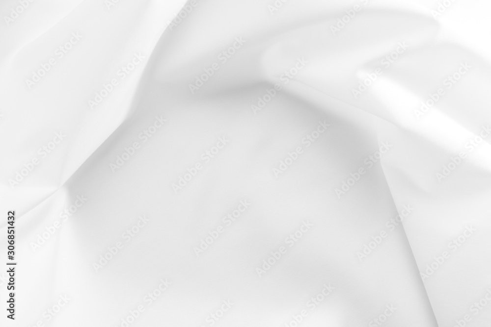 Abstract white fabric texture background. Cloth soft wave. Creases of satin, silk, and cotton. Abstract white fabric texture background. Cloth soft wave. Creases of satin, silk, and cotton.