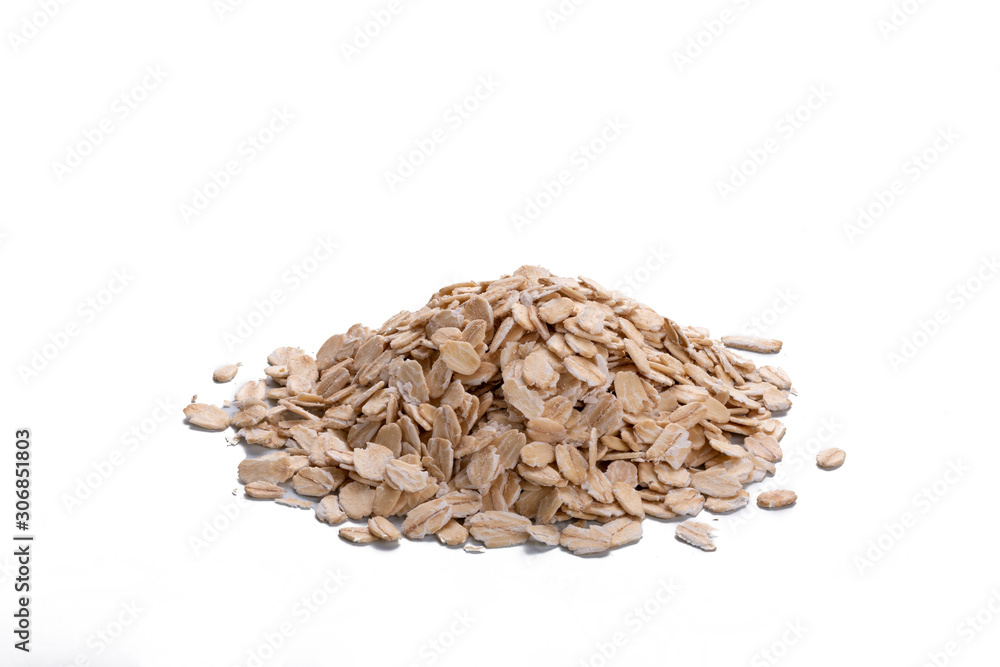 Depth of field of oat flakes isolated over white background. Uncooked oatmeal on white Depth of field of oat flakes isolated over white background. Uncooked oatmeal on white