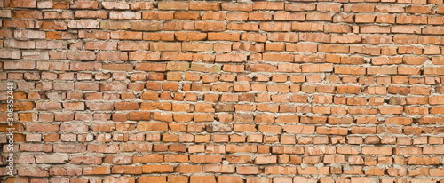 Texture of an old wall with red brick for background.