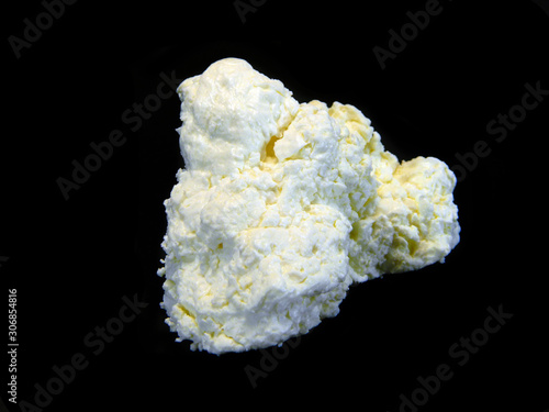 cottage cheese isolated on black background
