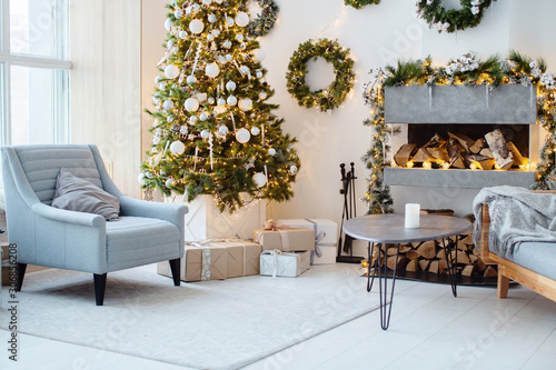 New Year's interior, holiday, Christmas, cozy and warm. Christmas tree and fireplace