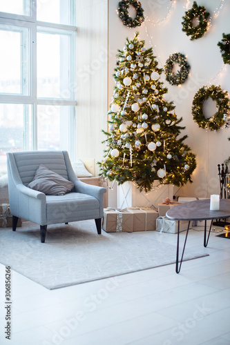 New Year's interior, holiday, Christmas, cozy and warm. Christmas tree and fireplace