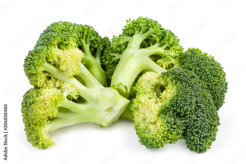 Branches of fresh broccoli on a white background close-up Branches of fresh broccoli on a white background close-up