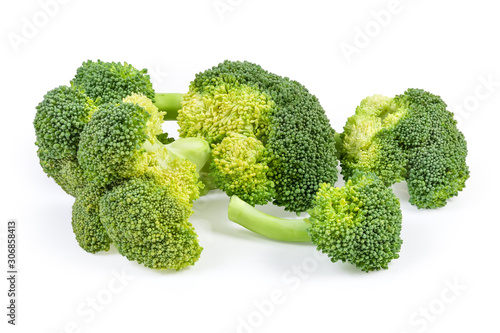 Pile of branches of fresh broccoli on a white background