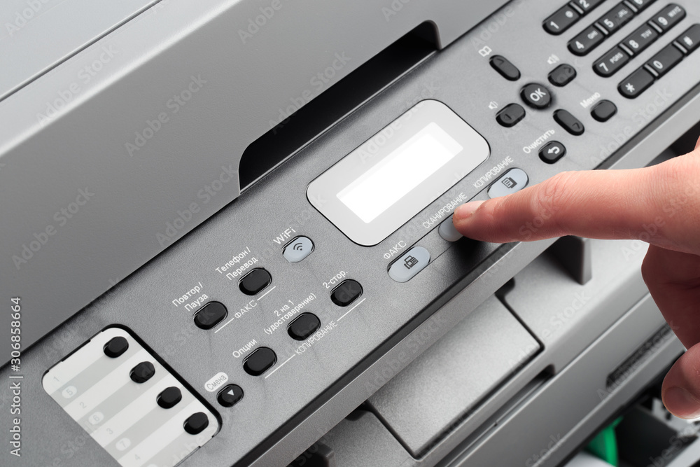 Hand press button on panel of printer. printer scanner laser office copy machine supplies start concept - Image Hand press button on panel of printer. printer scanner laser office copy machine supplies start concept - Image