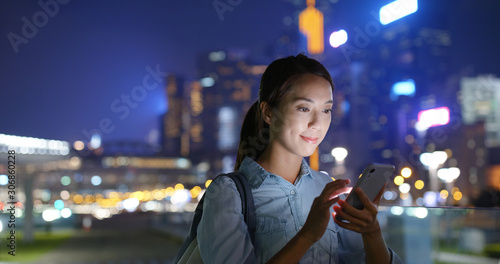 Canvas Print Woman work on smart phone at night