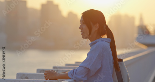 Photography Woman look at the city in sunset