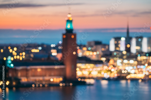 Stockholm, Sweden. Night Skyline Abstract Boke Bokeh Background. Design Backdrop. Tower Of Stockholm City Hall
