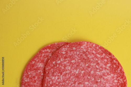 slices of salami in colorful background