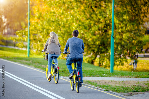 Wallpaper Mural Cyclists ride on the bike path in the city Park Torontodigital.ca