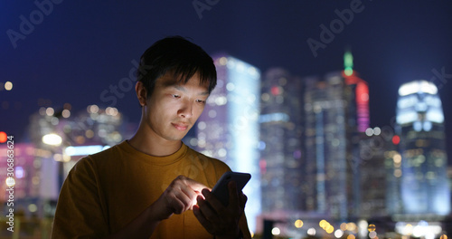 Man use of mobile phone at night