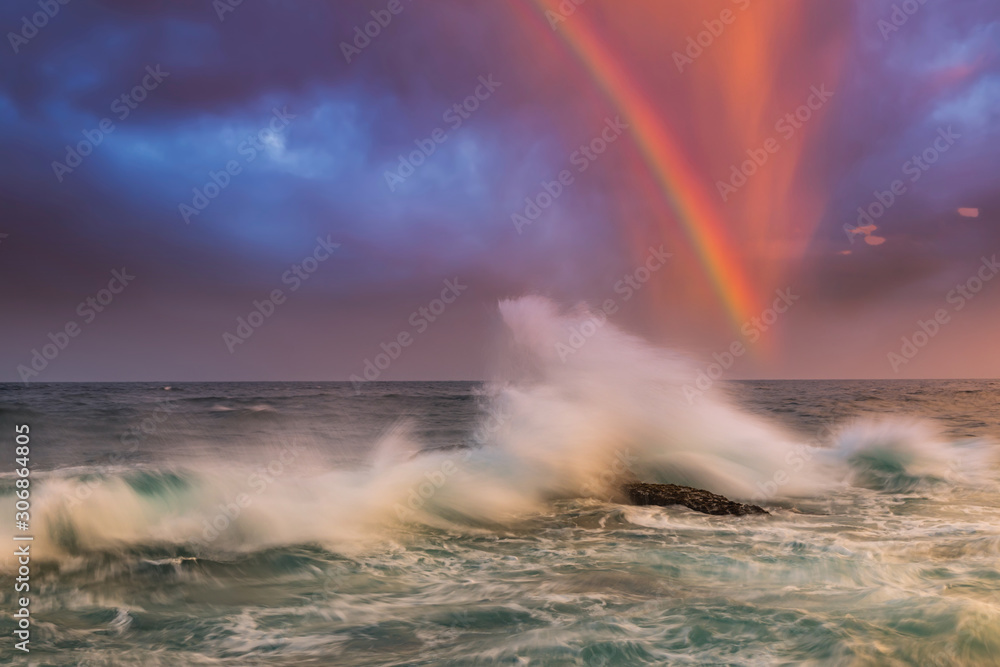 Dramatic sunset over the stormy sea. Summer vacation on tropical resort.