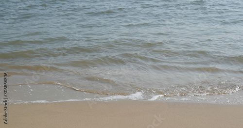 Sea wave on sand beach