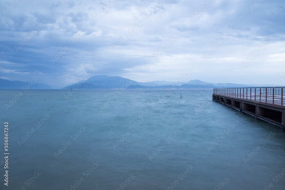 Lake of Garda in Sirmione by dusk Lombardy Italy