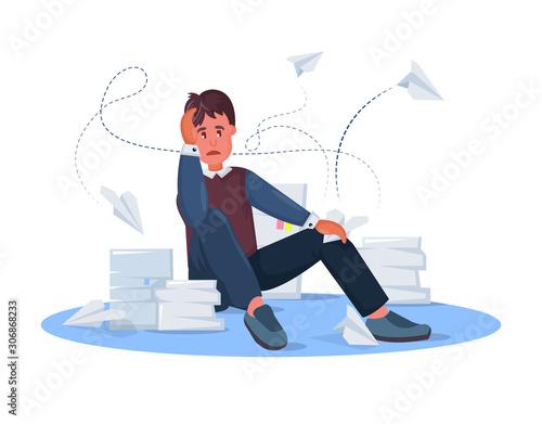 Tired male clerk with papers on the floor parses documents.