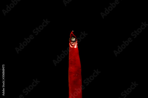 Mold on red pepper on black background