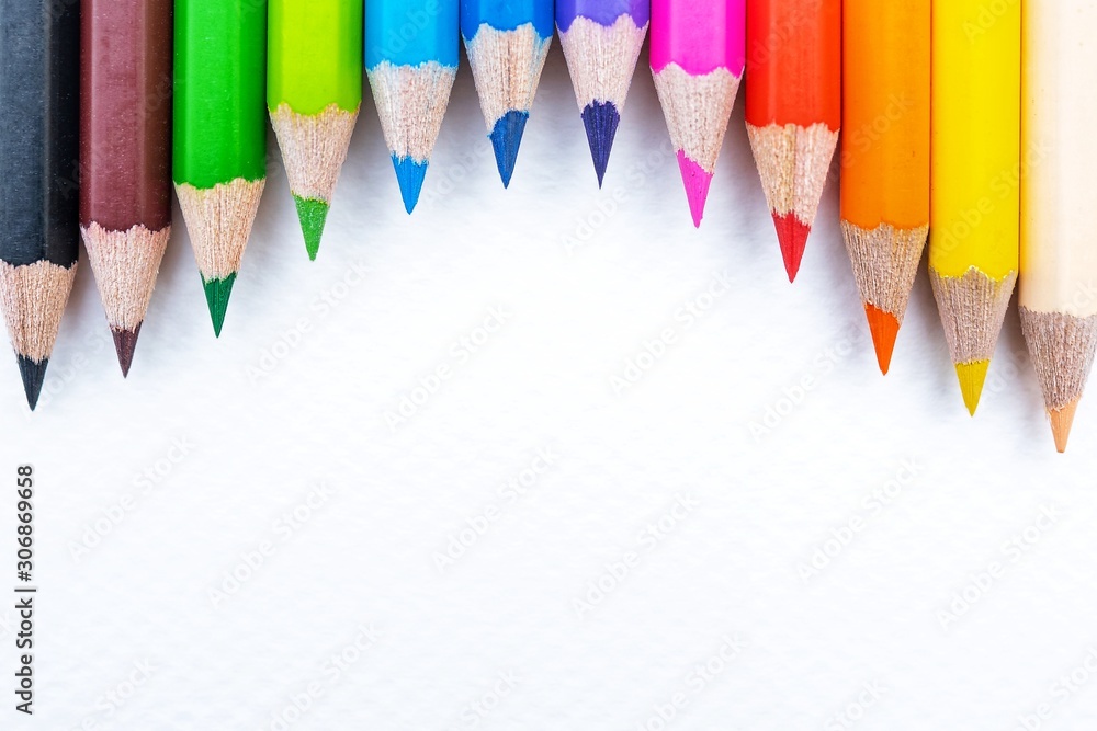 © Poh Smith - Top view of colourful crayons or colour pencil set in range isolated on white paper background.Education,Business office and Arts Concept.Copy space empty blank for text.Back to school © Poh Smith - Top view of colourful crayons or colour pencil set in range isolated on white paper background.Education,Business office and Arts Concept.Copy space empty blank for text.Back to school