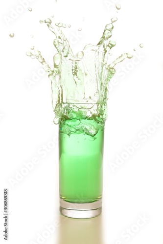 green water or drink splash out of a glass isolated on white background