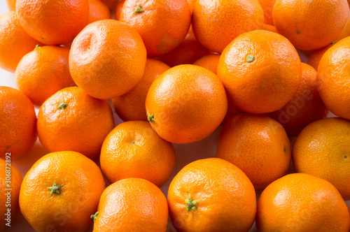 Top view. Fresh tangerines. Ripe and tasty mandarins. Clementines. Background tangerines. photo