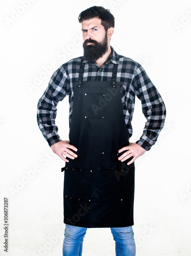 Bearded hipster wear apron for barbecue. Roasting and grilling food. Picnic and barbecue. Man cook brutal hipster. Fast food restaurant. Serious bearded cook. Restaurant staff. Ready to cook © be free