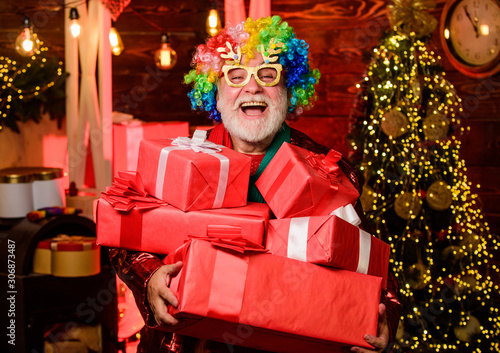 Christmas shopping idea concept. Merry christmas. happy new year. winter holiday shopping. party celebration. bearded man go shopping. xmas gifts. party man in colorful wig. presents from santa