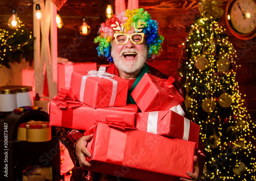 Christmas shopping idea concept. Merry christmas. happy new year. winter holiday shopping. party celebration. bearded man go shopping. xmas gifts. party man in colorful wig. presents from santa © be free