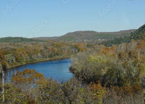 Scenic view of the White River surrounded by colorful trees of autumn in Arkansas.