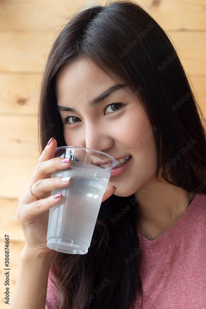 woman drinking fresh water; portrait of asian woman drinking fresh, clean water, concept of health care, sufficient hydration, good diet; east asian young adult woman model woman drinking fresh water; portrait of asian woman drinking fresh, clean water, concept of health care, sufficient hydration, good diet; east asian young adult woman model