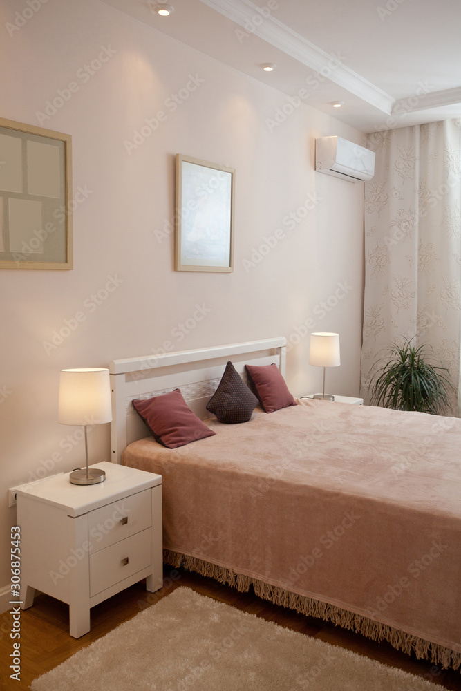 epmty minimalistic interior background, bedroom of modern apartment with double bed, lights on
