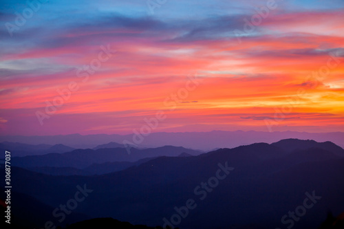 beautiful scenary in the north part of Thailand over the valley of mountain at sun rising giving a beautiful color.