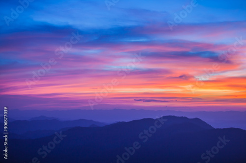 beautiful scenary in the north part of Thailand over the valley of mountain at sun rising giving a beautiful color. © alexzeer