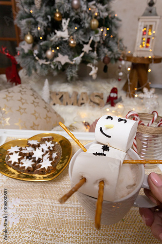 Marshmallow snowman float in hot chocolate at Christmas