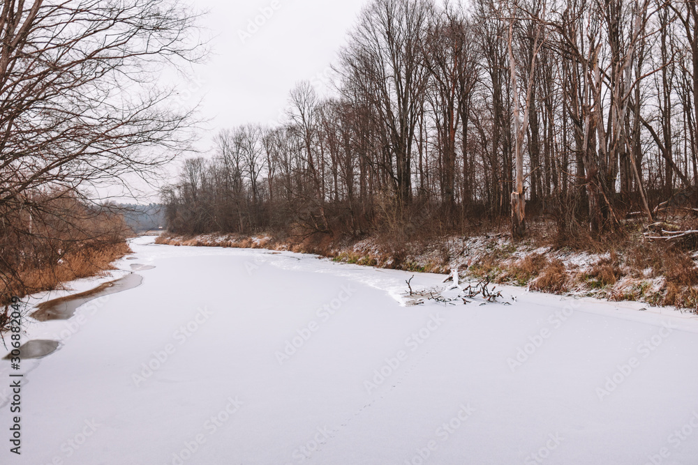 A river covered by snow and ice. Winter landscape A river covered by snow and ice. Winter landscape