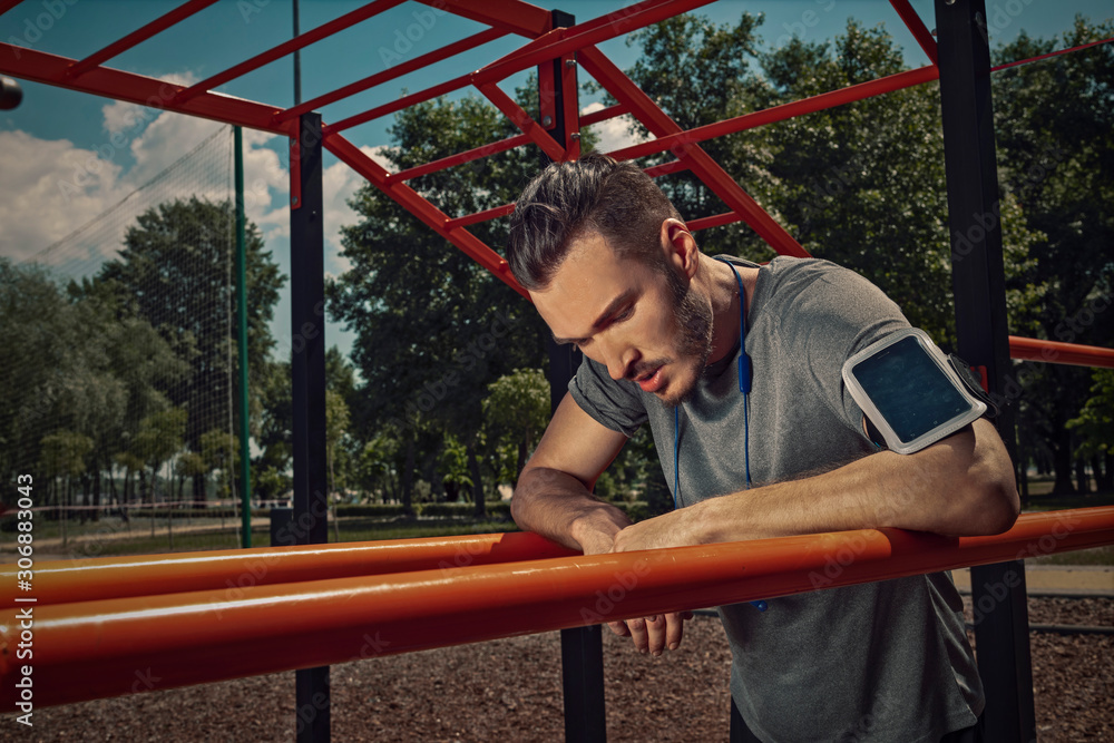 Athletic man exercising in the park. Athletic man exercising in the park.