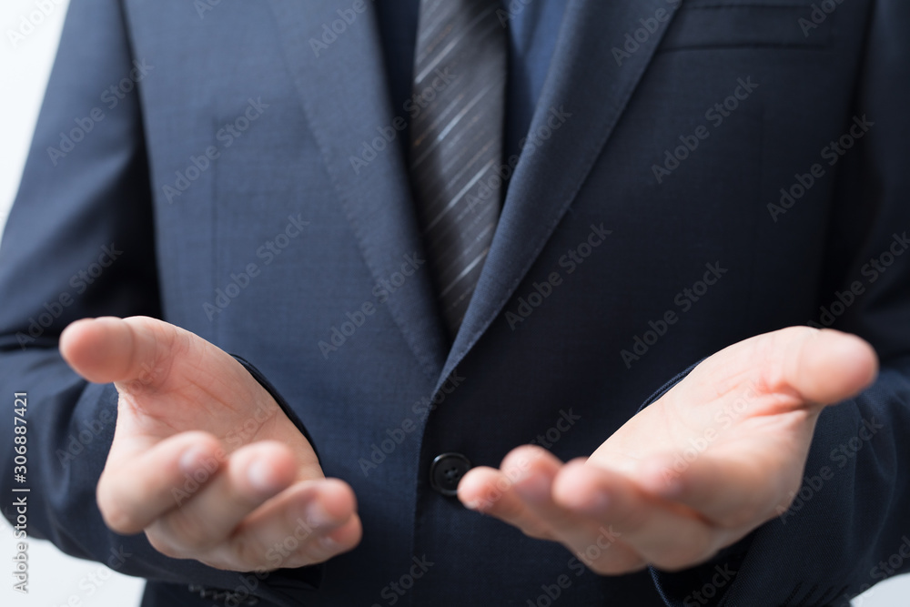 Fototapeta premium Businessman without head holding something without theme.