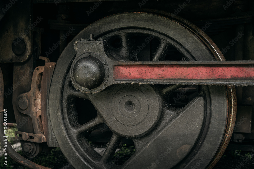Close up of the drive wheel from an old steam locomotive