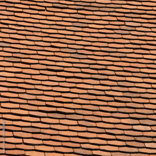 The surface of the roof of red tiles.