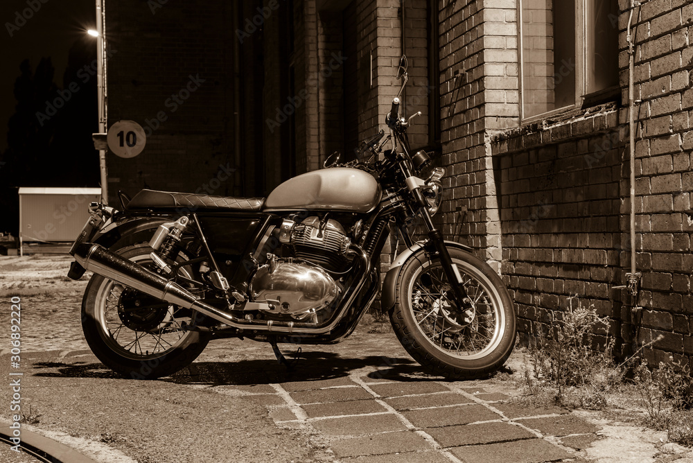 A motorcycle at night, a motorcycle stands under a street light, cruiser, vintage motorcycle, black and white photo A motorcycle at night, a motorcycle stands under a street light, cruiser, vintage motorcycle, black and white photo