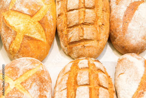 Loafs of fresh bread in bakery shop