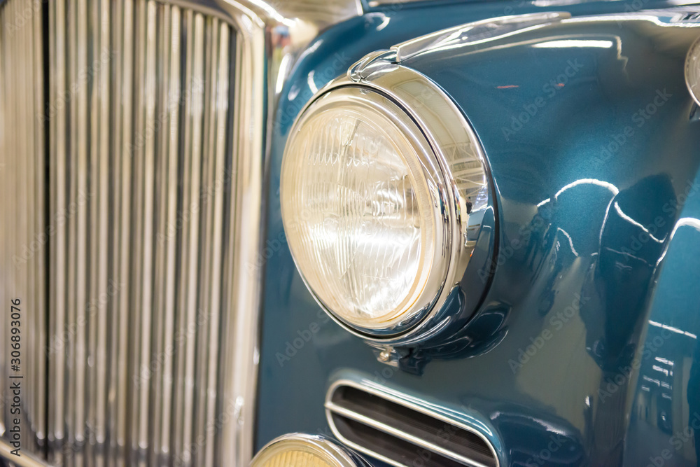 Retro blue car headlight from old vintage auto exhibition