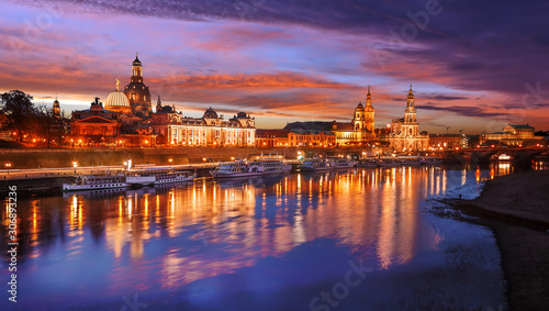 Awesome colorful scene during sunset at the Old Town in Dresden, Saxony, Germany. Famouse Sights: Frauenkirche, Hofkirche, Semperoper with reflected in calm water Elbe river. Postcard