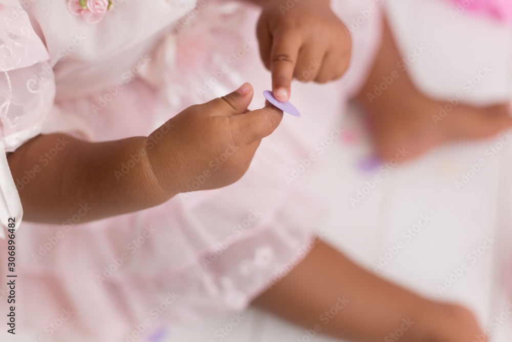 a child holding confetti . child's hand a child holding confetti . child's hand